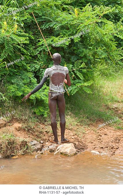 Surma man with body paintings on his back, Tulgit, Omo River Valley, Ethiopia, Africa