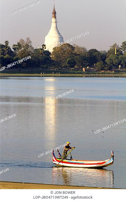 Myanmar, Mandalay, Lake Taungthaman. Empty tourist boat on Taungthaman Lake in Myanmar