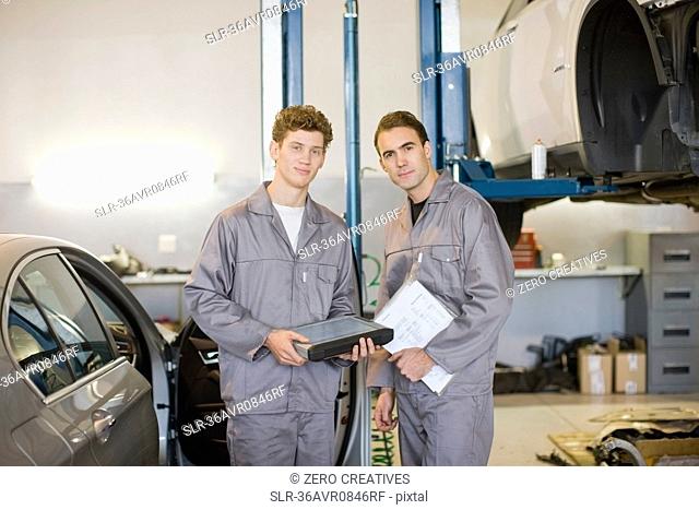 Mechanics working in garage