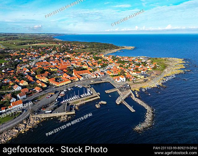 24 October 2023, Denmark, Svaneke: Town view of Svaneke, a small town on the north-eastern edge of the Danish island of Bornholm in the Baltic Sea (aerial view...