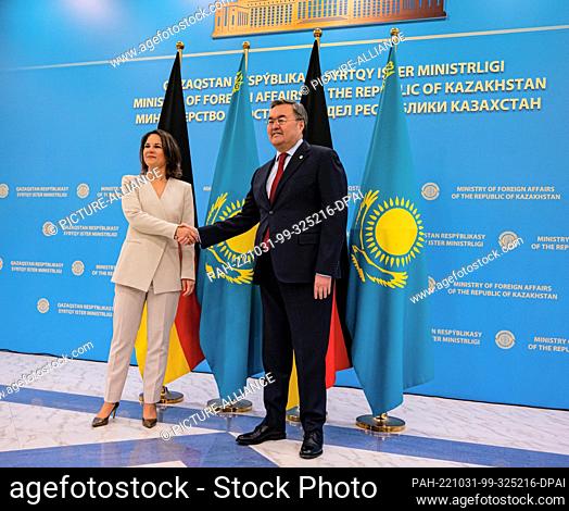 31 October 2022, Kazakhstan, Astana: Annalena Baerbock (Bündnis 90/Die Grünen), Foreign Minister, welcomes Mukhtar Tleuberdi