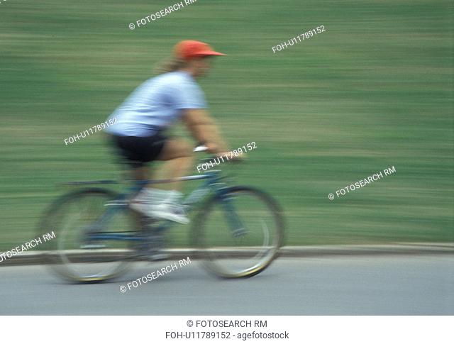 biking, Atlanta, GA, Georgia, Panning of a woman biking in Piedmont Park in Atlanta