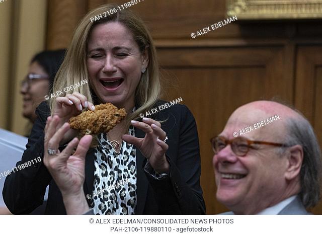 Representative Steve Cohen, Democrat of Tennessee, hands Rep. Katie Hill, Democrat of California, a piece of chicken from a bucket of Kentucky Fried Chicken he...