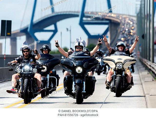 People cross the Koehlbrand Bridge on their Harley Davidson motorcycles in Hamburg, Germany, 26 June 2016. The Harley Days culminate in the traditional...
