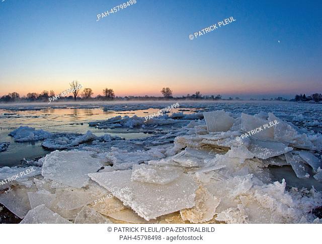 Ice floes tower on German-Polish border river Oder during sunrise in Lebus, Germany, 25 January 2014. Last night temperatures dropped to minus 15