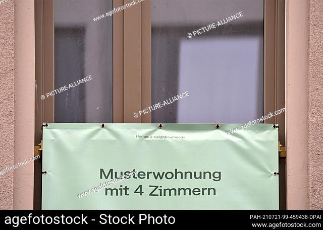 24 June 2021, Saxony, Leipzig: ""Show flat with 4 rooms"". Various notices hang on a newly built, multi-storey residential building in a direct location to the...