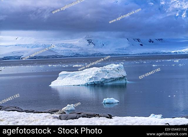 Iceberg Snow Mountains Blue Glaciers Damoy Point Antarctic Peninsula Antarctica. Glacier ice blue because air squeezed out of snow