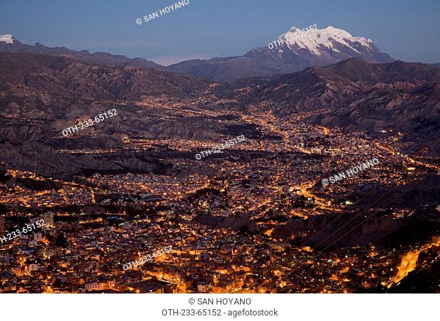 Cityscapes of La Paz and Nevado Illimani viewed from El Alto at night, Bolivia, South America