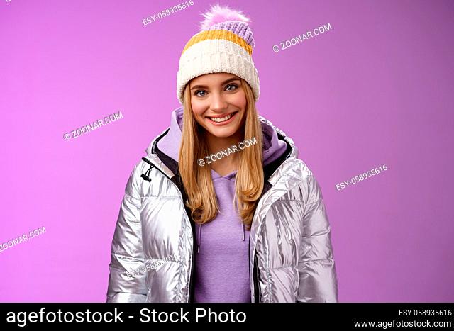 Lifestyle. Cute young blond european woman wearing warm cozy jacket hat ski resort vacation having fun smiling amused rent equipment wanna learn snowboarding...