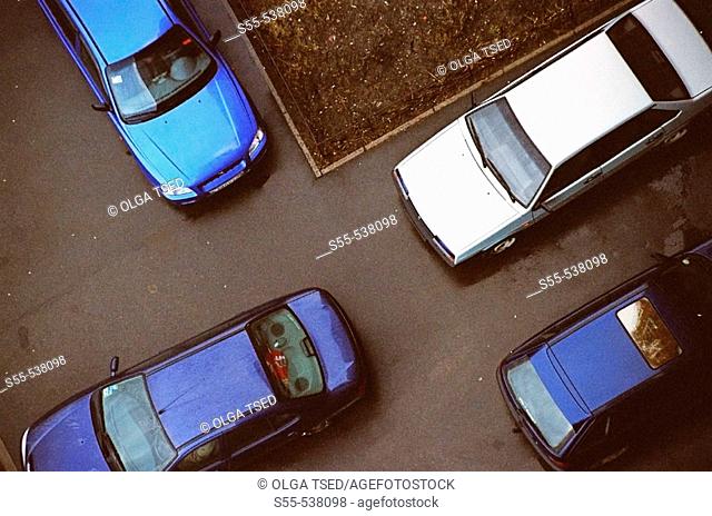 View of four cars taken from the 11th floor at one nasty day. St.-Petersburg, Russia