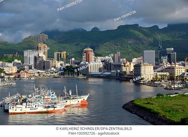 26 January 2018, Mauritius, Port Louis: View across the water of the modern city center with office towers and Le Caudan Waterfront in Port Louis