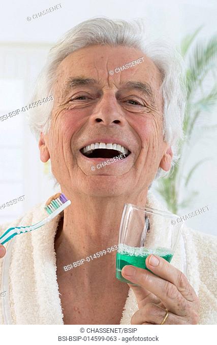 Senior man brushing his teeth