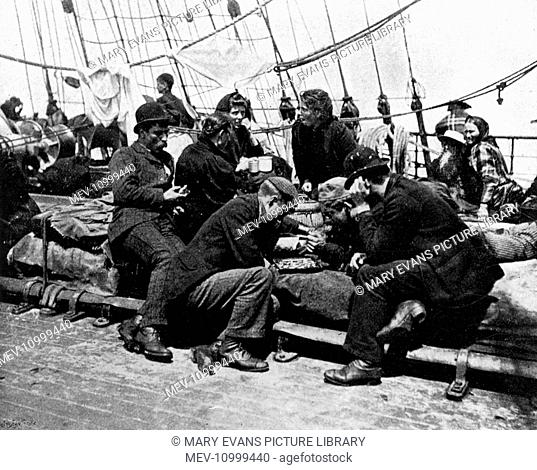 Steerage passengers on an emigrant ship out of Liverpool to New York, 1896. Recreations on board - the men appear to be playing chess or draughts