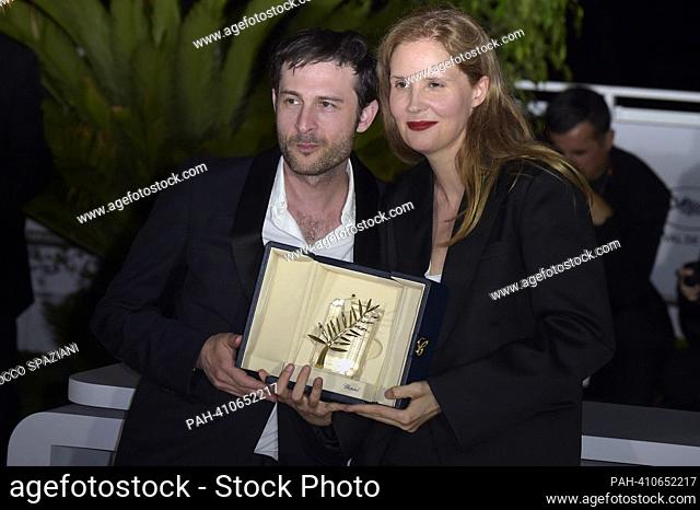 CANNES, FRANCE - MAY 27: Arthur Harari and Justine Triet poses with The Palme D'Or Award for 'Anatomy of a Fall' during the Palme D'Or winners photocall at the...