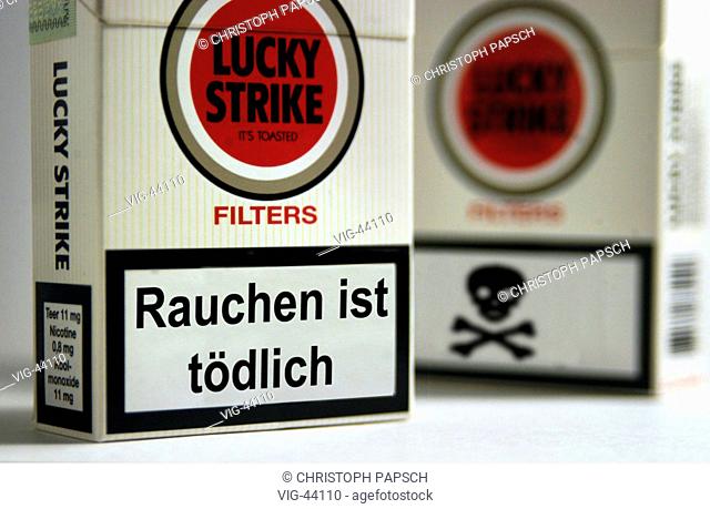 Lucky Strike cigarette packets with big warning sticker Smoking is fatal - BONN, GERMANY, 25/09/2003