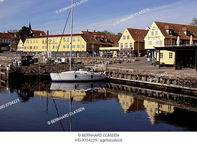 DENMARK, SVANEKE, 12.05.2013, Hotels Østersøen and Siemsens Gaard with sailing boat in the marina on Bornholm - Svaneke, Region Hovedstaden, Denmark, 12/05/2013