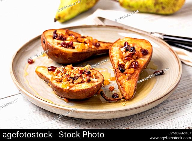 Sweet baked pears with honey, nuts, cranberries and cinnamon