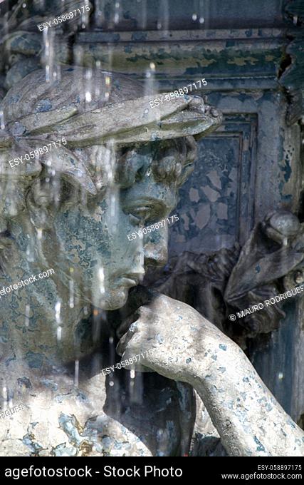 Detail view of the beautiful center statues of the fountain in the Rossio square located in Lisbon, Portugal