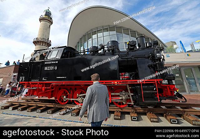 06 September 2022, Mecklenburg-Western Pomerania, Warnemünde: At the start of the Baltic resort's bridge festival, a locomotive of the ""Molli"" narrow-gauge...