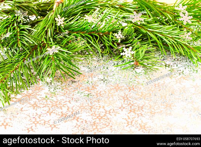 fir tree branch and snow flares confetti with copy space. Merry Christmas and New Year concept