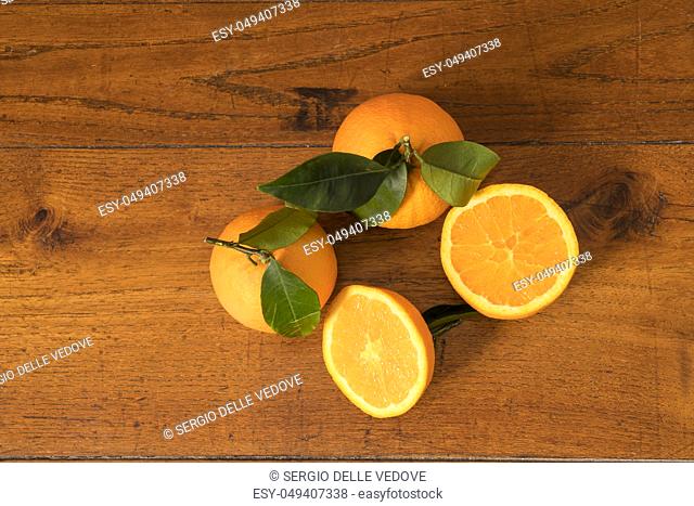 make a juice of oranges on a wooden table