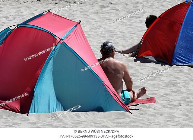 Beach visitors enjoy the sunny weather at the Baltic resort KÃ¼hlungsborn, Germany, 26 May 2017. On the last weekend of the month the high ""Walrita"" is...