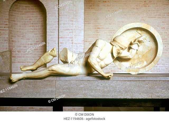 Fallen warrior from the East Pediment of the Temple of Aphaia, Isle of Aegina, Greece, built c500-c480 BC. This item is now in the Munich Glyptothek in Germany