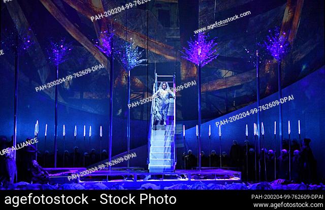 03 February 2020, Thuringia, Erfurt: Uwe Stickert (M) as Lohengrin and the opera choir rehearse a scene from Richard Wagner's opera Lohengrin on the stage of...