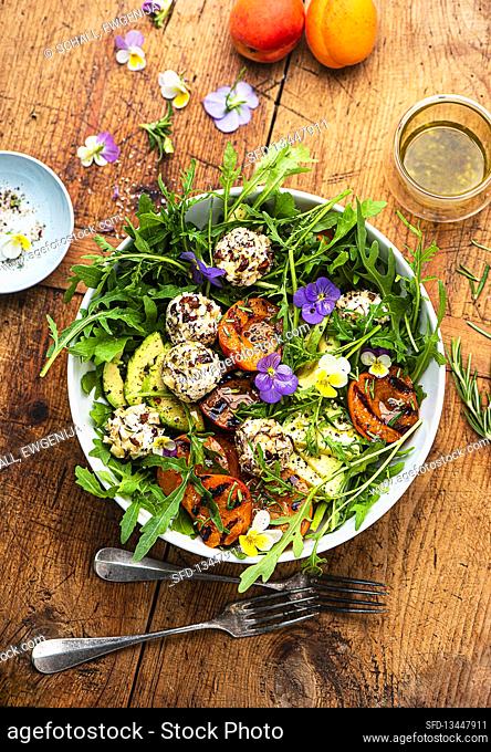 Summer rocket salad with grilled apricots and herb goat cheese balls