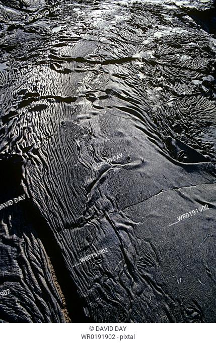Line of folded 'ropey' pahoehoe lava Bahia Sullivan, Santiago Island, Galapagos, Ecuador