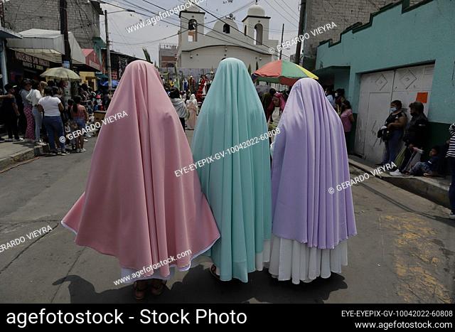 MEXICO CITY, MEXICO - APR 10, 2022: Residents of San Francisco Culhuacán, Coyoacán, take part during rendering of the Holy week procession to celebrate Palm...