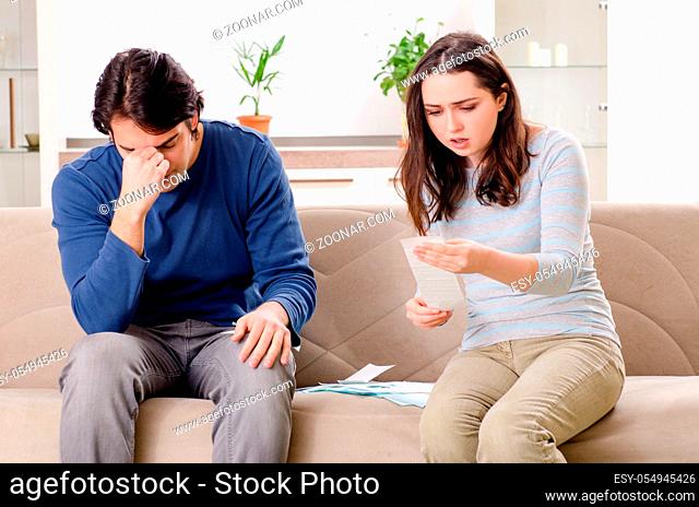 Young couple in budget planning concept