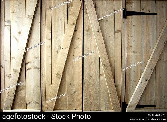 Traditional wooden barn doors detail of farm house doors, close-up clean and modern background textue