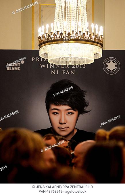 A poster depicts Chinese pianist, drummer and laureate Ni Fan at the award ceremony of the instrumentalist prize 'Prix Montblanc' in the Konzerthaus in Berlin