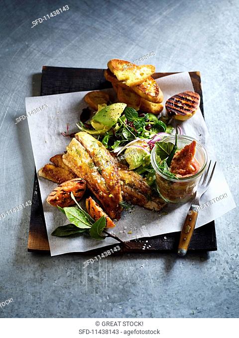 Cod with salad, grilled fruit, grilled bread and guava achaar