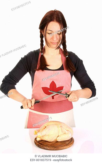housewife sharpening a knife with sharpener