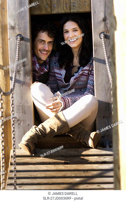 Couple in hut in playground