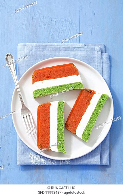 Three-coloured terrine with tomatoes, cream cheese and green peas