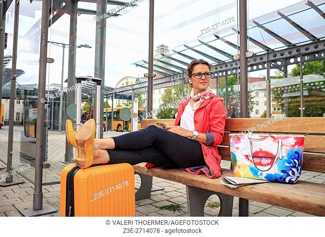 portrait of a young woman at bus and rail station