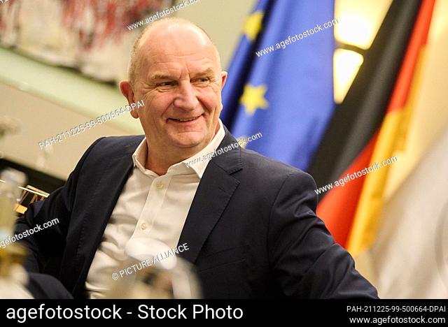 22 December 2021, Brandenburg, Potsdam: Dietmar Woidke (SPD), Minister President of the state of Brandenburg, laughs during an interview at the end of the year