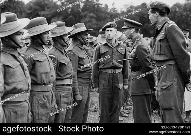 The King speaks to men of the Gurkha Regiment, the Gurkhas have been conspicuous for their bravery. H.M. is accompanied by Brigadier H.H