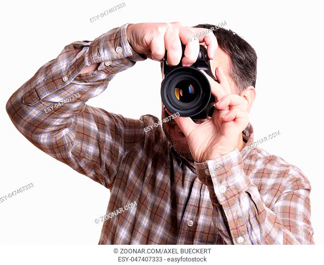 man taking photograph with dslr camera