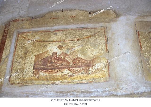 Erotic wall painting in ancient brothel in excavations of Pompeji in Italy