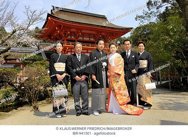 Japanese wedding couple with their parents in front of the Kamigamo Shrine, Kyoto, Japan, Asia