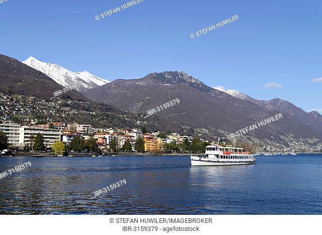 Excursion boat on Lake Maggiore with the city of Locarno, Ticino, Switzerland