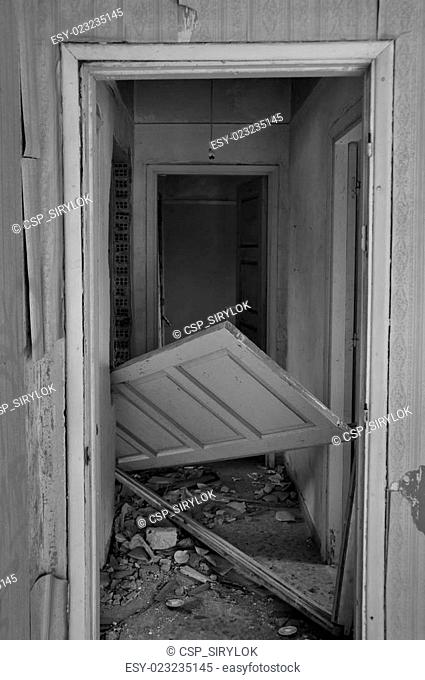 unhinged door abandoned house