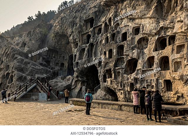 The Longmen Caves, some of the finest examples of Chinese Buddhist art housing tens of thousands of statues of Buddha and his disciples; Luoyang, Henan Province