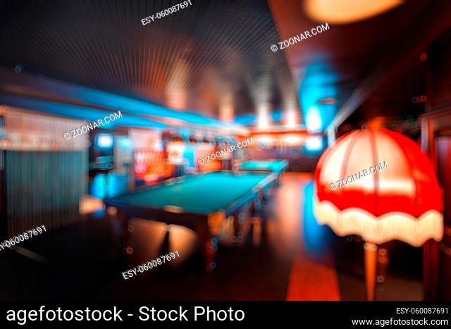abstract blur. brand new and modern billiard interior in night time