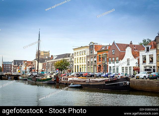 Zwolle, Netherlands - September 26, 2020: Citycentre of Zwolle with canals, old historic ships and houses and bridge
