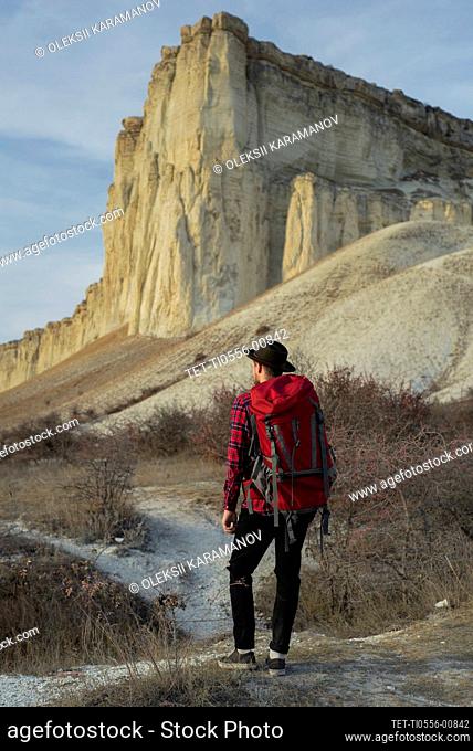 Ukraine, Crimea, Hiker looking at White Mountain
